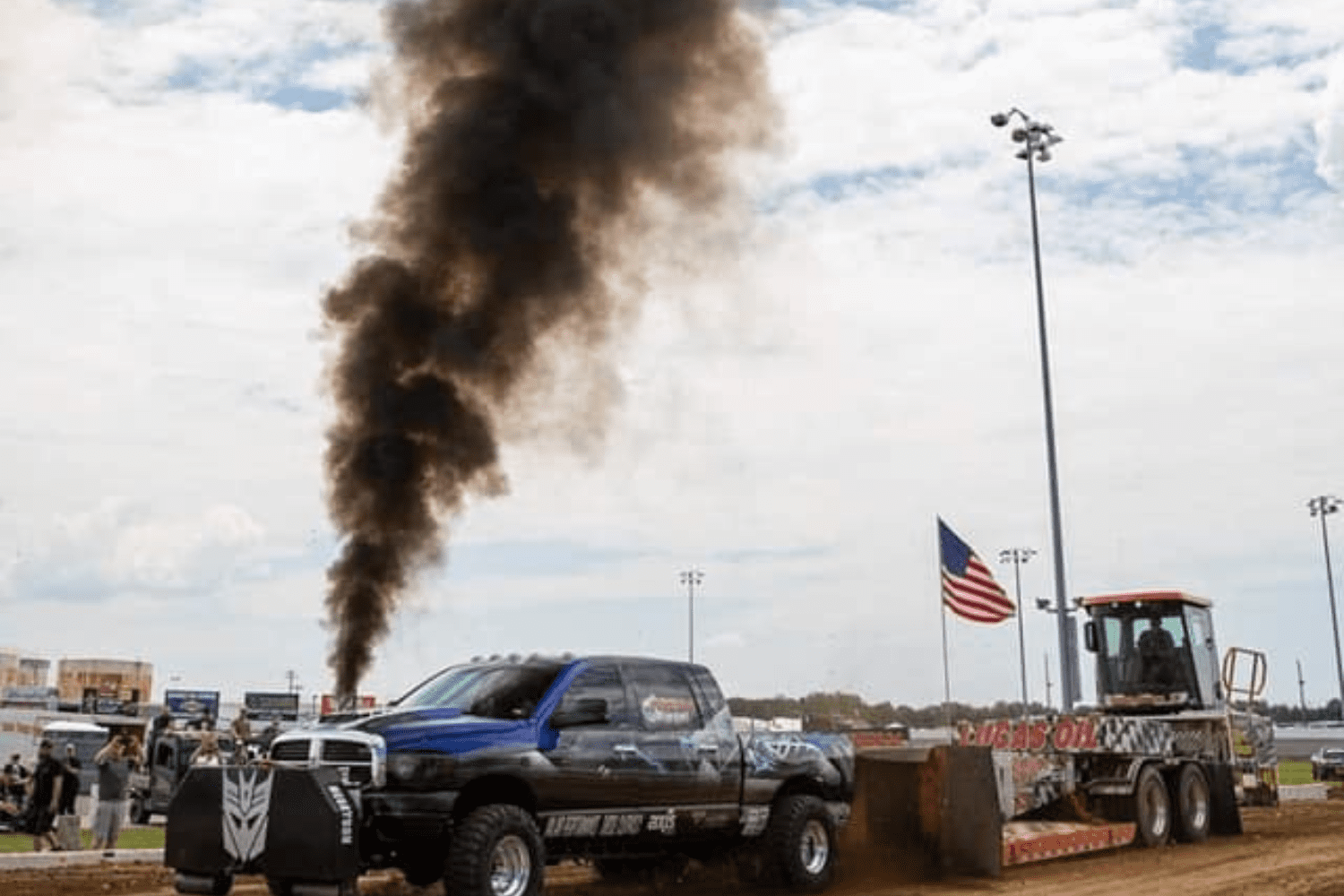 Megatron blue vehicle emitting gas on the ground